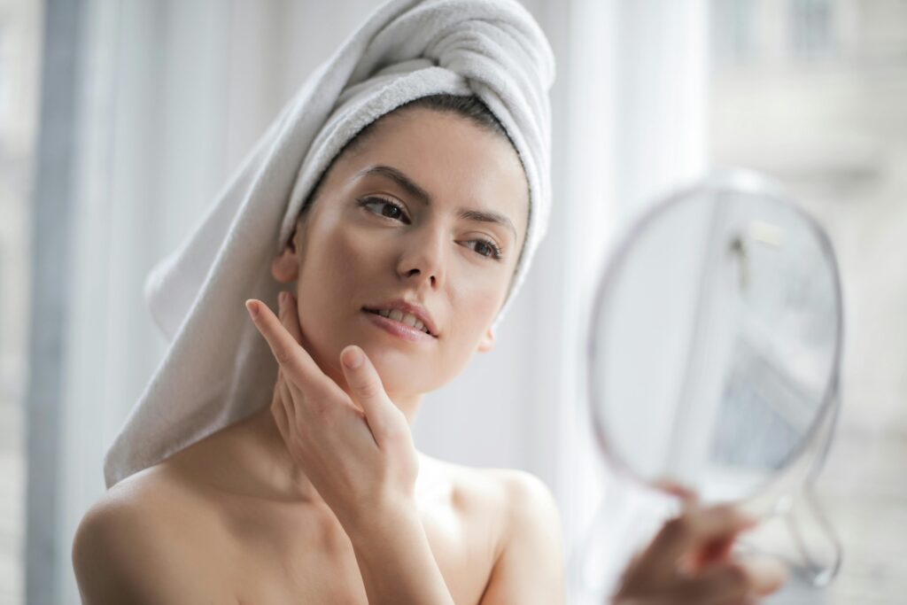 skincare products ritual, enhancing her natural beauty in the comfort of her home.