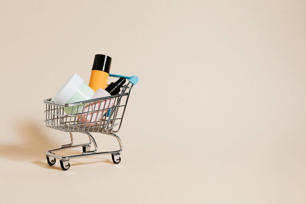 UK beauty market 2025 - mini shopping cart filled with cosmetics