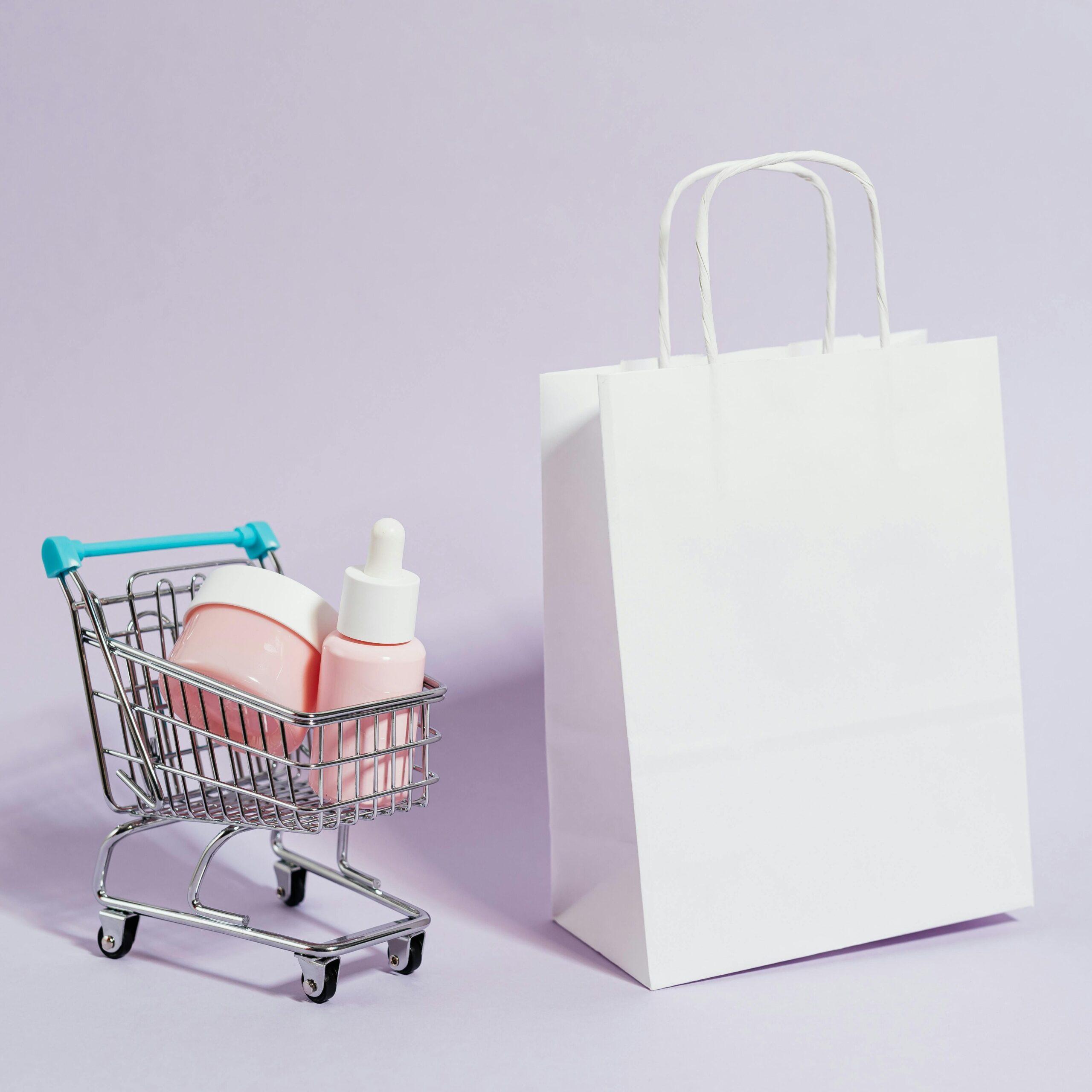 A minimalist image featuring a shopping cart with cosmetics and a white paper bag, ideal for Black Friday promotions.