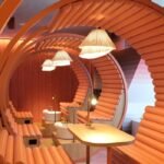 Stylish office interior with unique curved seating and decorative lighting.