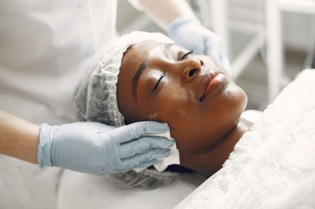Extraction - A woman receiving a gentle facial treatment during a spa session for skincare and relaxation.