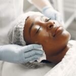 Extraction - A woman receiving a gentle facial treatment during a spa session for skincare and relaxation.