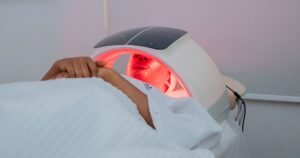 A relaxing LED light therapy treatment at a modern spa in Abuja, Nigeria.